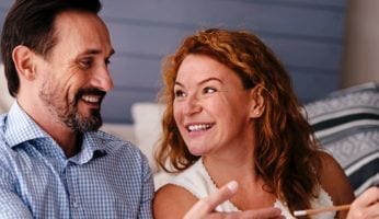 Woman and man are smiling