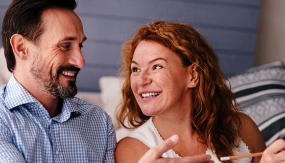 Woman and man are smiling